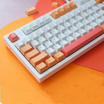 clavier gaming avec un kit de keycaps peach