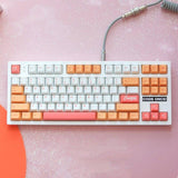 clavier custom avec des keycaps peach
